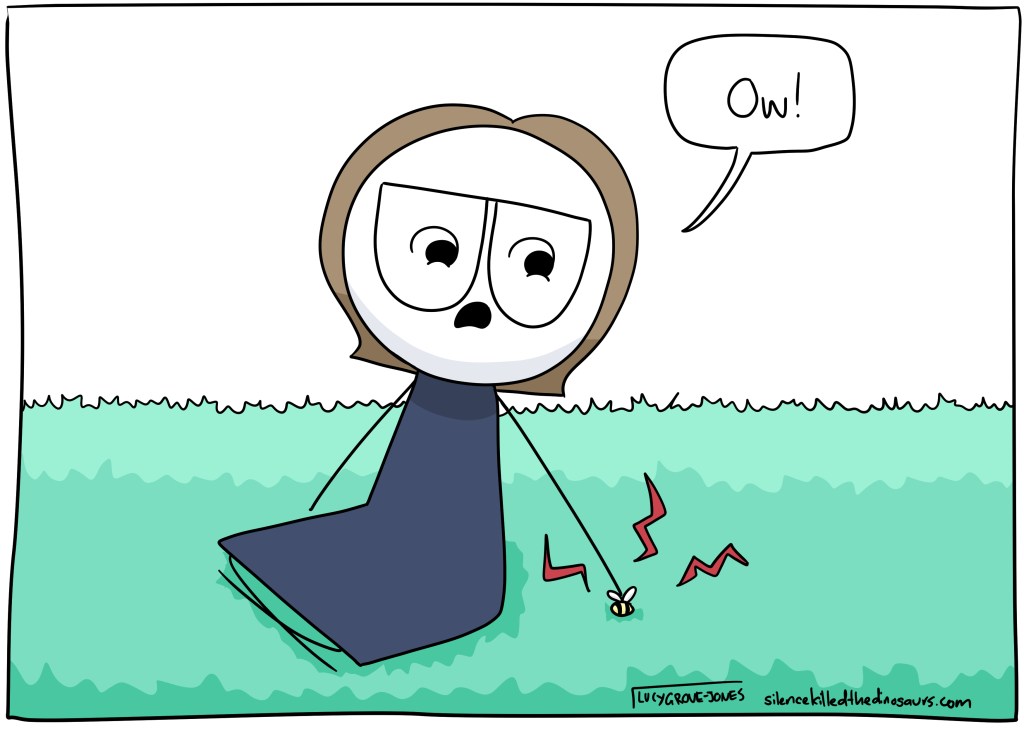 Child-me is sitting on the grass. My hand has landed on a bee. I say: "Ow!"