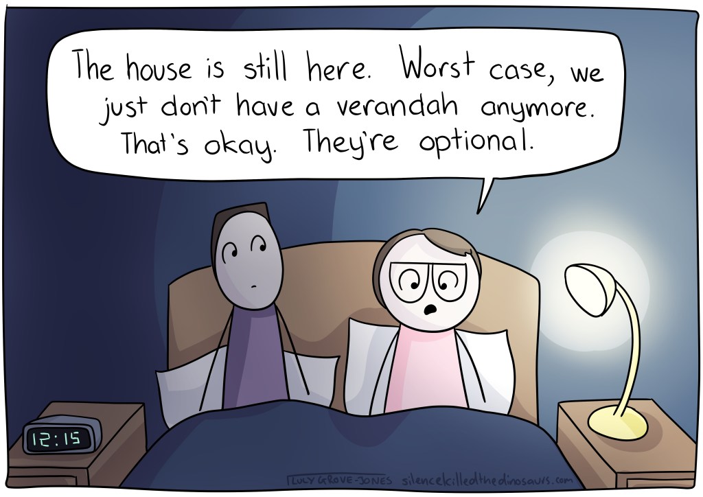 Comic Lucy and her partner are in bed, sitting together. Comic Lucy says 'The house is still here. Worst case, we just don't have a verandah anymore. That's okay. They're optional.'