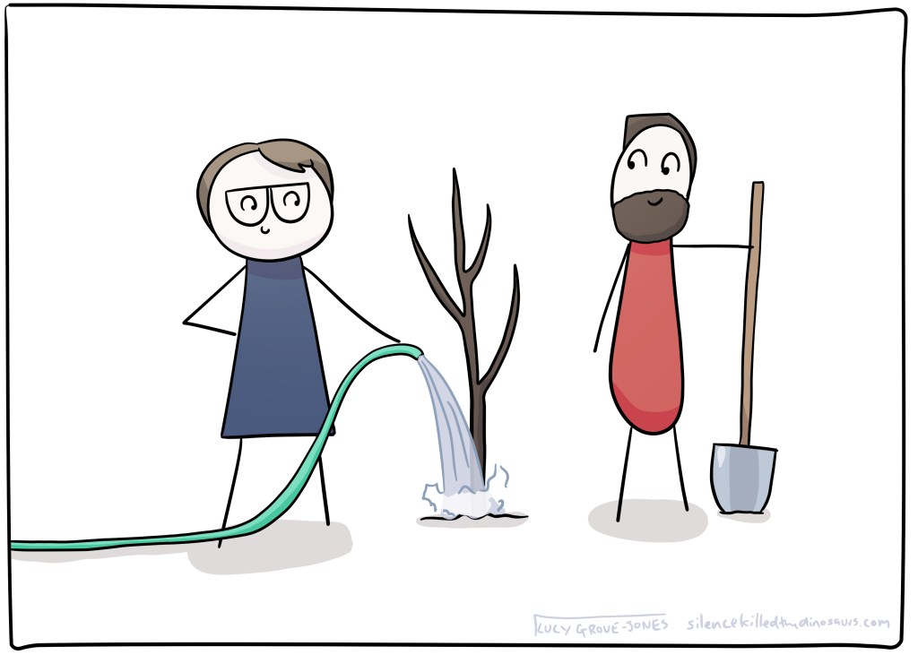 Comic Lucy and her partner stand next to a recently planted tree